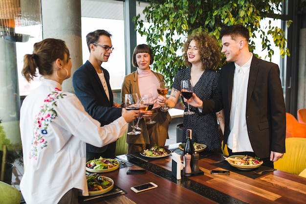 Group of friends eating in restaurant