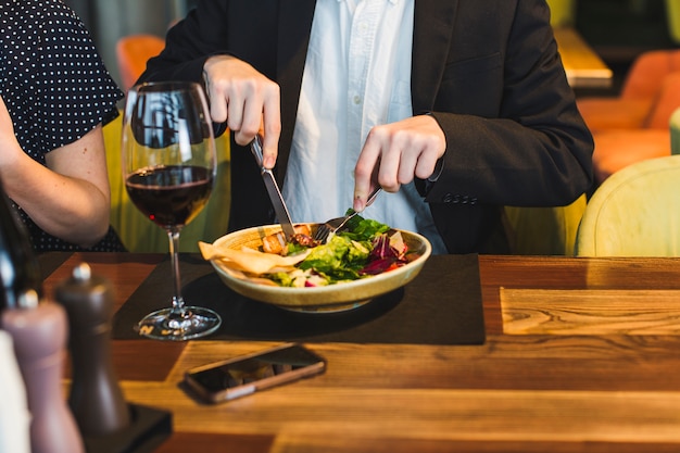 Group of friends eating in restaurant