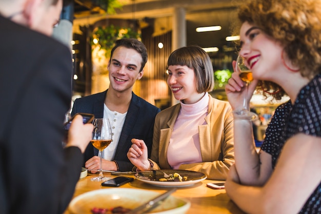 Group of friends eating in restaurant