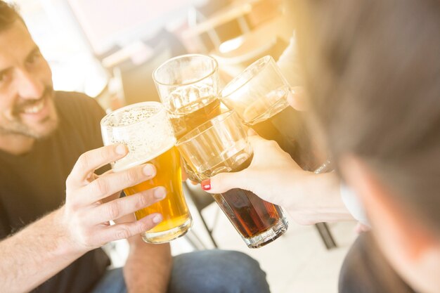 Group of friends enjoying evening drinks in bar