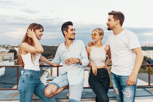 Group of friends enjoying outdoors at roof