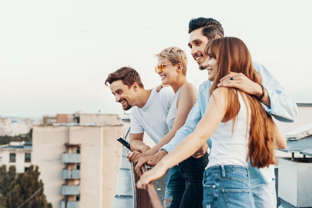 Group of friends enjoying outdoors at roof