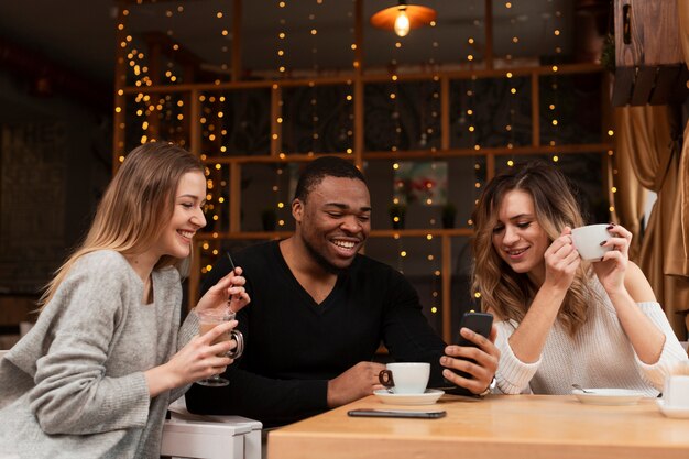 Group of friends having coffee