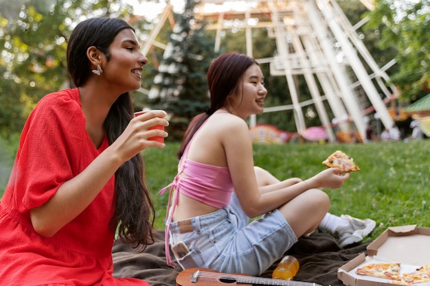 Group of friends having fun together at a ferris wheel