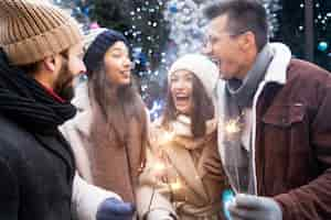 Free photo group of friends holding sparklers together