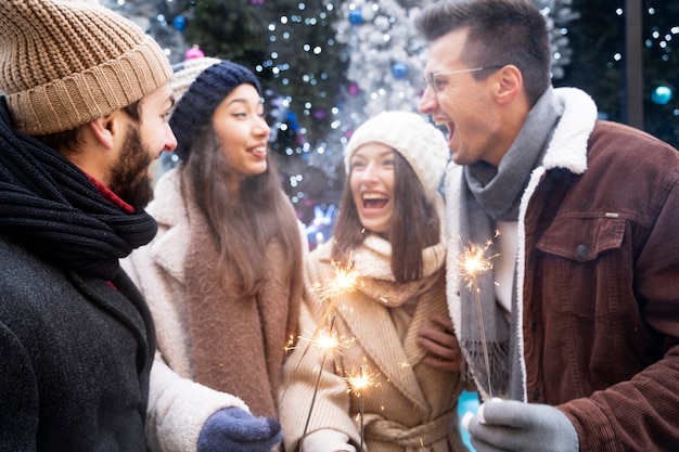 Group of friends holding sparklers together