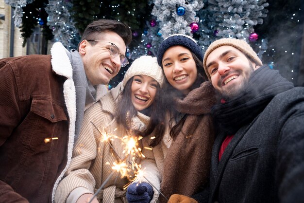 Group of friends holding sparklers together