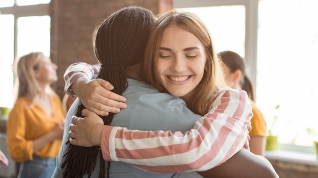 Group of friends hugging each other