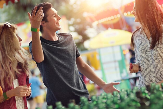 A group of friends is enjoying the amusement park