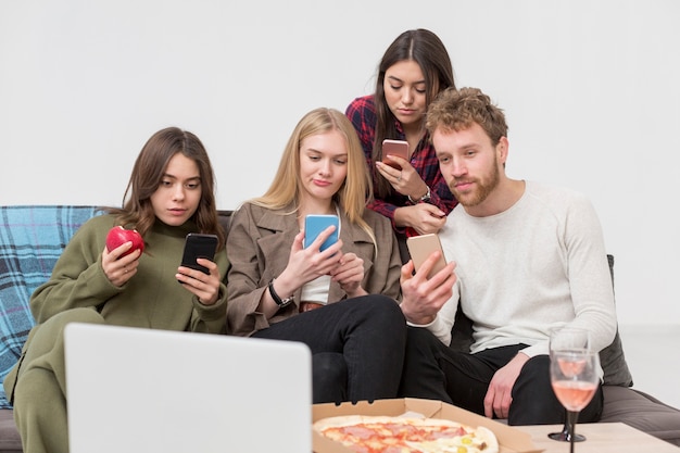 Group of friends looking at mobile