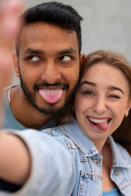 Free photo group of friends making funny grimaces