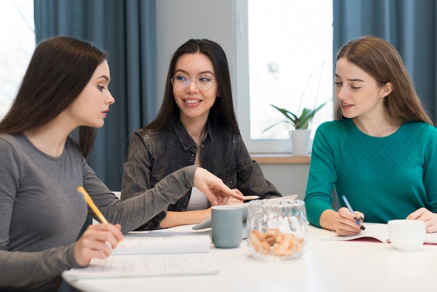 Group of friends making plans together at home