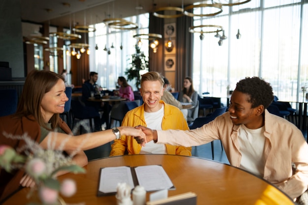 Free photo group of friends meeting at restaurant