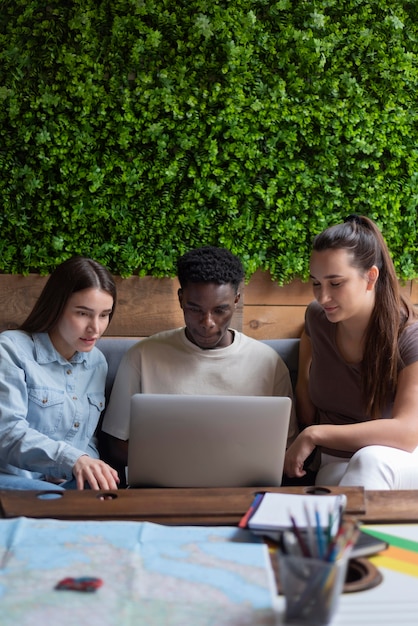 Group of friends planning a trip in a cafe