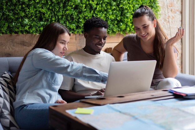 Group of friends planning a trip in a cafe