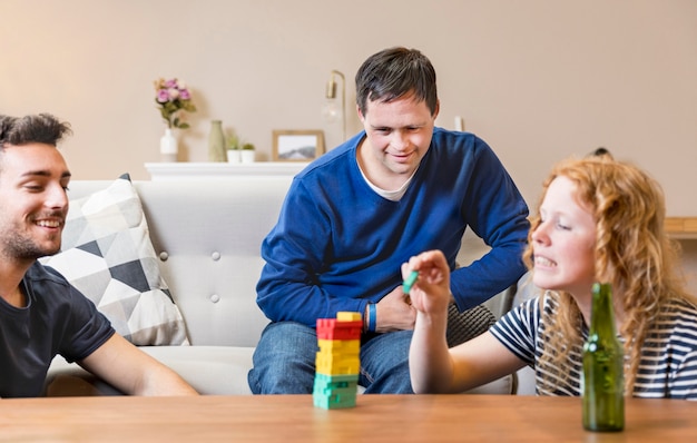 Group of friends playing games while having beer