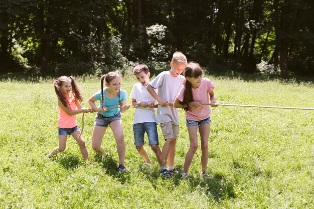 Group of friends playing tug of war