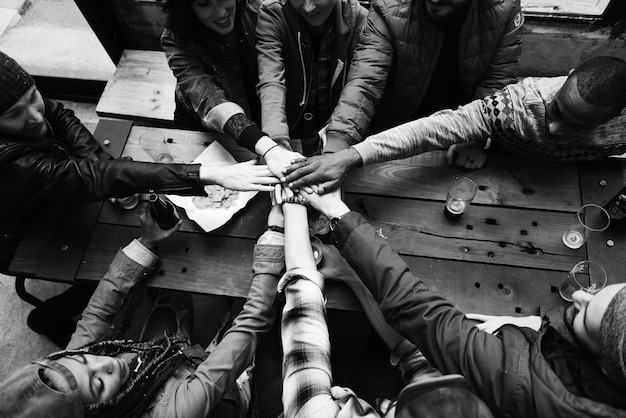 Group of friends stacking hands