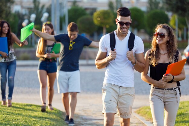 A group of friends talking in the street after class