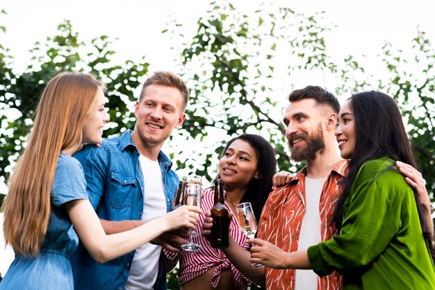 Group of friends together with drinks