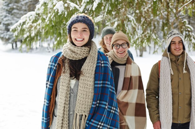 Group of Friends in Winter Forest