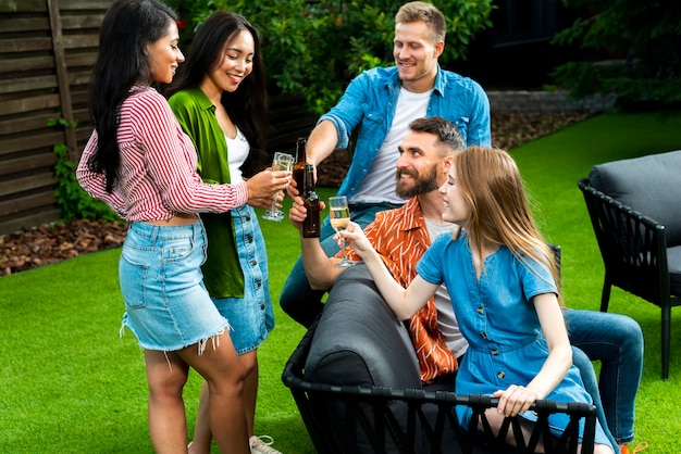 Group of friends with drinks outdoors