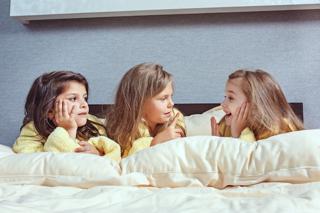 The group of girlfriends taking goog time on bed