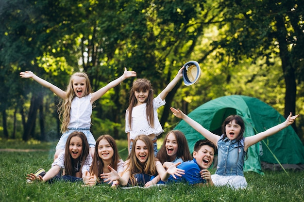 Group of girls camping in forest