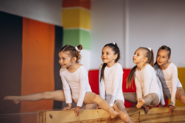 Group of girls exercising at gymnastic school