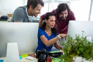 Free photo group of graphic designers interacting over computer