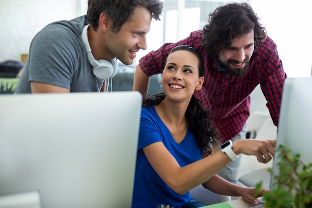 Free photo group of graphic designers interacting over computer