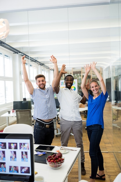 Free photo group of graphic designers raising arms