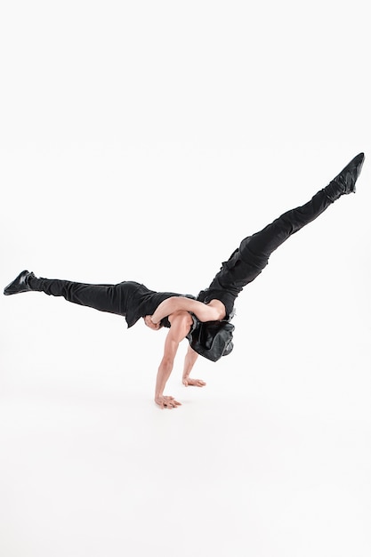 group of gymnastic acrobatic caucasian men on balance pose