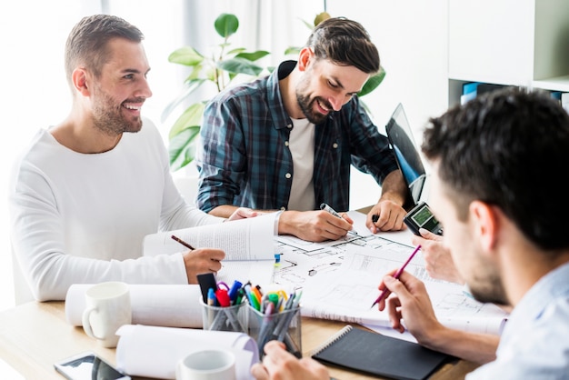 Group of happy businessmen working in office