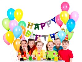 Free photo group of happy children in colorful shirts having fun at the birthday party - isolated on a white