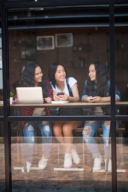 Group of happy friends student talking about knowledge in cafe