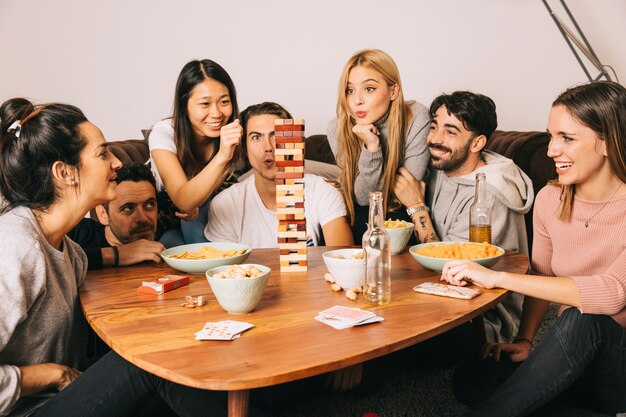 Group of happy playing tabletop game