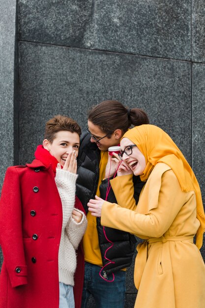 Group of happy teenagers laughing together