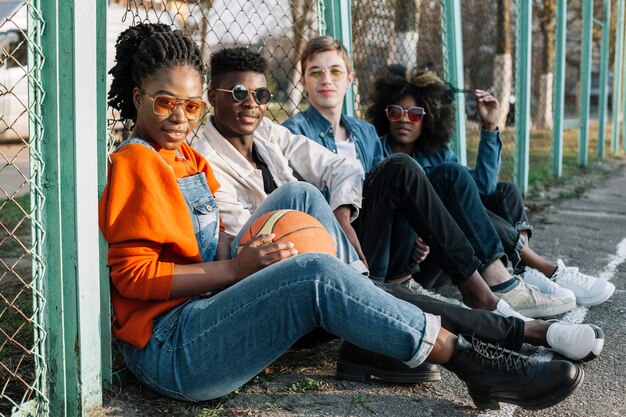 Group of happy teenagers posing outdoors