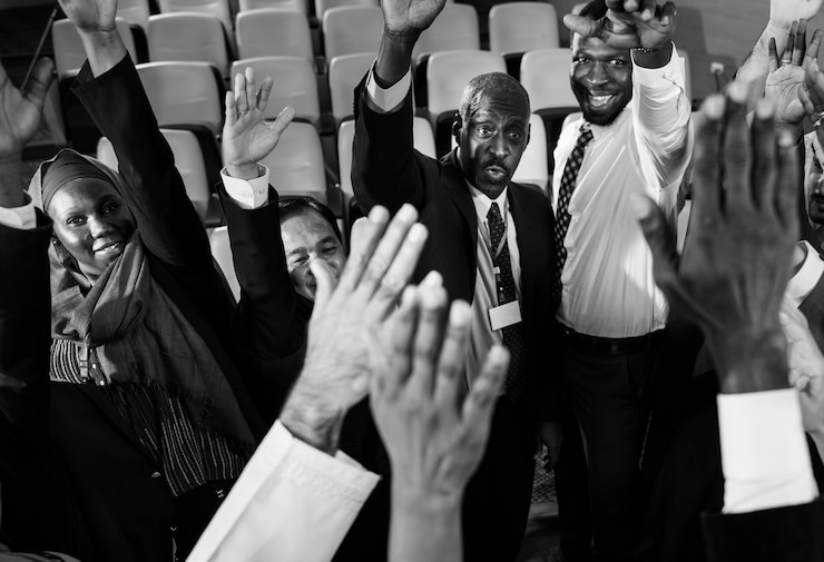 Free Photo group of international business people raising their hands