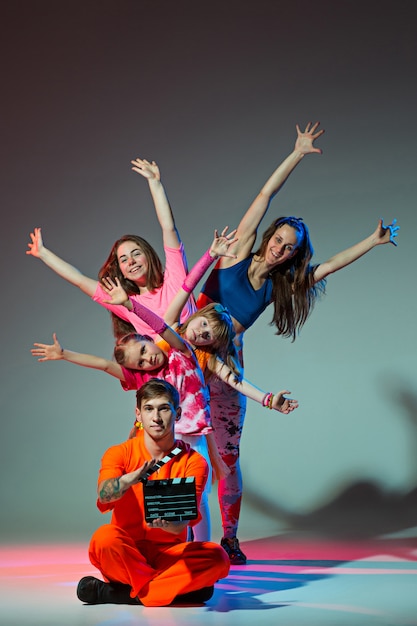 Group of man, woman and teens dancing hip hop choreography