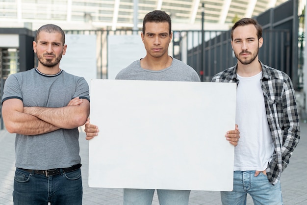 Group of men demonstrating together 