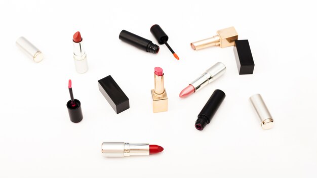 Group of metallic lipsticks on white background
