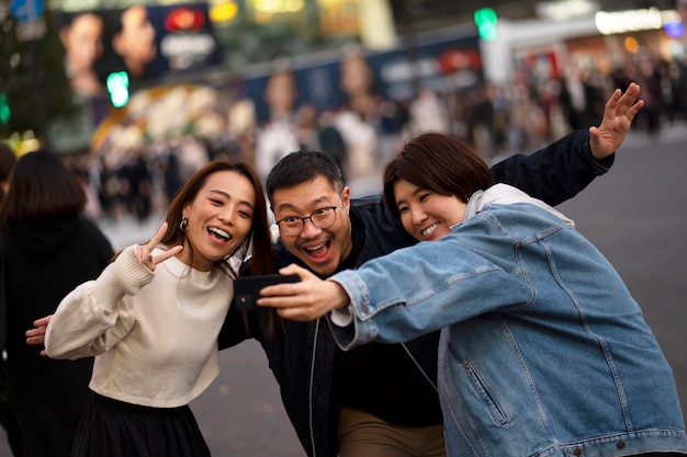 Group of middle age friends having fun at night