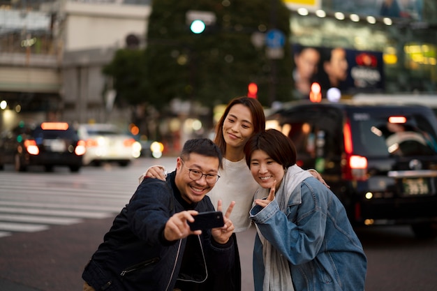 Group of middle age friends having fun at night