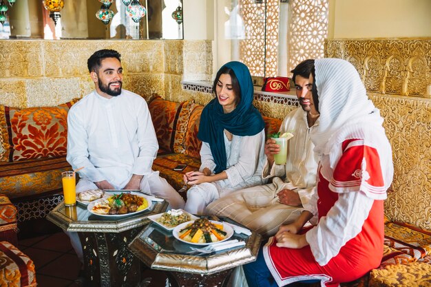 Group of muslim friends in restaurant