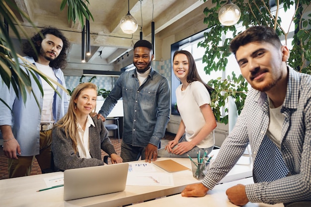 Group office portrait of happy diverse colleagues