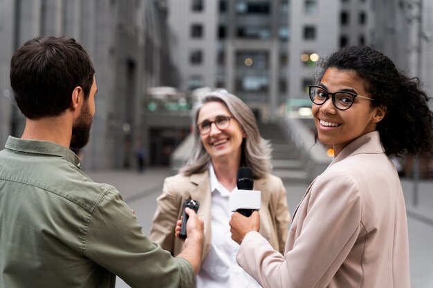 group of people doing a journalism interview