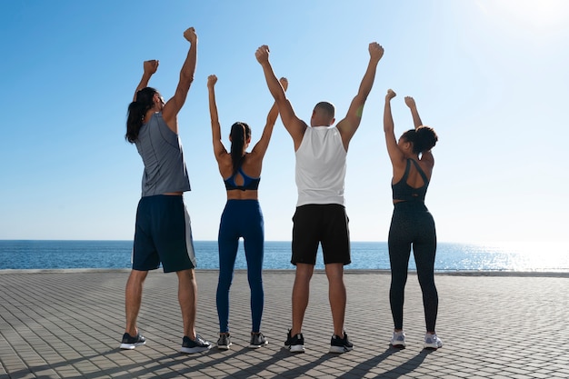 group of people exercising together outdoors