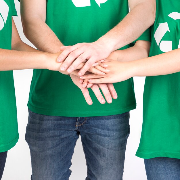 Group of people holding hands together